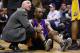 EAST RUTHERFORD, NJ - MARCH 27: Kobe Bryant #24 of the Los Angeles Lakers is attended to by athletic trainer Gary Vitti during the game against the New Jersey Nets during the game on March 27, 2009 at the Izod Center in East Rutherford, New Jersey. NOTE TO USER: User expressly acknowledges and agrees that, by downloading and/or using this Photograph, User is consenting to the terms and conditions of the Getty Images License Agreement. (Photo by Chris McGrath/Getty Images)