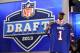 NEW YORK, NY - APRIL 25: E.J. Manuel of the Florida State Seminoles holds up a jersey on stage after he was picked #16 overall by the Buffalo Bills in the first round of the 2013 NFL Draft at Radio City Music Hall on April 25, 2013 in New York City. (Photo by Al Bello/Getty Images)