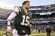 Dec. 23, 2012; East Rutherford, NJ, USA; New York Jets quarterback Tim Tebow (15) runs off the field after the game against the San Diego Chargers at MetLife Stadium. Chargers won 27-17. Mandatory Credit: Debby Wong-USA TODAY Sports