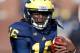 ANN ARBOR, MI - NOVEMBER 17: Denard Robinson #16 of the Michigan Wolverines looks for running room during a first quarter run while playing the Iowa Hawkeyes at Michigan Stadium on November 17, 2012 in Ann Arbor, Michigan. (Photo by Gregory Shamus/Getty Images)
