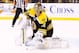 BOSTON, MA - APRIL 4: Tuukka Rask #40 of the Boston Bruins makes a glove save against the New Jersey Devils during the game on April 2, 2013 at TD Garden in Boston, Massachusetts. (Photo by Jared Wickerham/Getty Images)