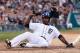 DETROIT, MI - APRIL 26: Torii Hunter #48 of the Detroit Tigers slides into home plate on a third inning RBI single by Victor Martinez #41 while playing the Atlanta Braves at Comerica Park on April 26, 2013 in Detroit, Michigan. (Photo by Gregory Shamus/Getty Images)