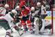 Apr 30, 2013; Chicago, IL, USA; Minnesota Wild goalie Josh Harding (37) reaches for the puck in front of Chicago Blackhawks right wing Marian Hossa (81) during the third period in game one of the first round of the 2013 Stanley Cup playoffs at the United Center. Mandatory Credit: Rob Grabowski-USA TODAY Sports