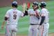 SAN DIEGO, CA - APRIL 27: Brandon Crawford #35 of the San Francisco Giants (C) is congratulated by Brandon Belt #9, left, and Hunter Pence #8 after hitting a three-run homer during the second inning of a baseball game against the San Diego Padres at Petco Park on April 27, 2013 in San Diego, California. (Photo by Denis Poroy/Getty Images)