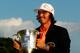 CHARLOTTE, NC - MAY 06: Rickie Fowler of the United States celebrates with the championship trophy after defeating Rory McIlroy of Northern Ireland and D.A. Points of the United States in a playoff during the final round to win the Wells Fargo Championship at the Quail Hollow Club on May 6, 2012 in Charlotte, North Carolina. (Photo by Streeter Lecka/Getty Images)