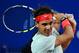 BARCELONA, SPAIN - APRIL 27: Rafael Nadal returns the ball to Milos Raonic of Canada during his semi-final match of day six of the 2013 Barcelona Open Banc Sabadell on April 27, 2013 in Barcelona, Spain. Rafael Nadal won 6-4, 6-0. (Photo by David Ramos/Getty Images)