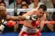 LAS VEGAS, NV - MAY 04: Floyd Mayweather Jr. (L) throws a left at Robert Guerrero during the fifth round of their WBC welterweight title bout at the MGM Grand Garden Arena on May 4, 2013 in Las Vegas, Nevada. Mayweather won by unanimous decision. (Photo by Ethan Miller/Getty Images)
