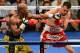 LAS VEGAS, NV - MAY 04: Floyd Mayweather Jr. (L) throws a left at Robert Guerrero during the fifth round of their WBC welterweight title bout at the MGM Grand Garden Arena on May 4, 2013 in Las Vegas, Nevada. Mayweather won by unanimous decision. (Photo by Ethan Miller/Getty Images)