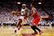 MIAMI, FL - MAY 06: LeBron James #6 of the Miami Heat drives against Jimmy Butler #21 of the Chicago Bulls during Game One of the Eastern Conference Semifinals of the 2013 NBA Playoffs at American Airlines Arena on May 6, 2013 in Miami, Florida. NOTE TO USER: User expressly acknowledges and agrees that, by downloading and/or using this photograph, user is consenting to the terms and conditions of the Getty Images License Agreement. (Photo by Chris Trotman/Getty Images)