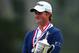 Webb Simpson hugs the US Open trophy after winning at Olympic CC in 2012. HE shared his faith at the FCA breakfast as part of The Players 2013.