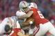 Nov 17, 2012; Madison, WI, USA; Ohio State Buckeyes quarterback Braxton Miller (5) is tackled by Wisconsin Badgers linebacker Mike Taylor (53) during the third quarter at Camp Randall Stadium. Ohio State defeated Wisconsin 21-14 in overtime. Mandatory Credit: Jeff Hanisch-USA TODAY Sports