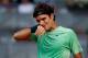 MADRID, SPAIN - MAY 09: Roger Federer of Switzerland reacts in his match against Kei Nishikori of Japan on day six of the Mutua Madrid Open tennis tournament at the Caja Magica on May 9, 2013 in Madrid, Spain. (Photo by Gonzalo Arroyo Moreno/Getty Images)