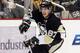 March 28, 2013; Pittsburgh, PA, USA; Pittsburgh Penguins center Sidney Crosby (87) carries the puck up ice against the Winnipeg Jets during the second period at the CONSOL Energy Center. Mandatory Credit: Charles LeClaire-USA TODAY Sports