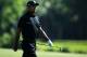 PONTE VEDRA BEACH, FL - MAY 10: Tiger Woods of the USA walks on the 14th hole during round two of THE PLAYERS Championship at THE PLAYERS Stadium course at TPC Sawgrass on May 10, 2013 in Ponte Vedra Beach, Florida. (Photo by Richard Heathcote/Getty Images)
