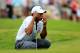 PONTE VEDRA BEACH, FL - MAY 11: Tiger Woods of the USA lines up a putt on the ninth green during round three of THE PLAYERS Championship at THE PLAYERS Stadium course at TPC Sawgrass on May 11, 2013 in Ponte Vedra Beach, Florida. (Photo by Sam Greenwood/Getty Images)