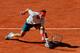 MADRID, SPAIN - MAY 10: Rafael Nadal of Spain slides to play a backhand to David Ferrer of Spain on day seven of the Mutua Madrid Open tennis tournament at the Caja Magica on May 10, 2013 in Madrid, Spain. (Photo by Jasper Juinen/Getty Images)