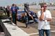 Legendary Mario Andretti takes a call while grandson Marco Andretti prepares for a practice run in St. Petersburg. Credit: Dwight Drum