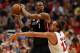 CHICAGO, IL - MAY 13: Chris Bosh #1 of the Miami Heat looks to pass against Joakim Noah #13 in Game Four of the Eastern Conference Semifinals during the 2013 NBA Playoffs at the United Center on May 13, 2013 in Chicago, Illinois. The Heat defeated the Bulls 88-65. NOTE TO USER: User expressly acknowledges and agrees that, by downloading and or using this photograph, User is consenting to the terms and conditions of the Getty Images License Agreement. (Photo by Jonathan Daniel/Getty Images)