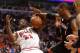 May 13, 2013; Chicago, IL, USA; Chicago Bulls small forward Jimmy Butler (21) attempts to shoot the ball against Miami Heat center Chris Bosh (1) during the second half at the United Center. Miami defeats Chicago 88-65. Mandatory Credit: Mike DiNovo-USA TODAY Sports