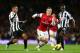 LONDON, ENGLAND - DECEMBER 29: Jack Wilshere of Arsenal breaks away from Sylvain Marveaux and Cheik Tiote of Newcastle United during the Barclays Premier League match between Arsenal and Newcastle United at the Emirates Stadium on December 29, 2012 in London, England. (Photo by Clive Mason/Getty Images)