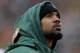 GREEN BAY, WI - JANUARY 01: Charles Woodson #21 of the Green Bay Packers, who did not dress for a game against the Detroit Lions, watches from the sidelines at Lambeau Field on January 1, 2012 in Green Bay, Wisconsin. The Packers defeated the Lions 45-41. (Photo by Jonathan Daniel/Getty Images)