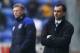 WIGAN, ENGLAND - FEBRUARY 04: Roberto Martinez of Wigan and David Moyes of Everton watch proceedings during the Barclays Premier League match between Wigan Athletic and Everton at DW Stadium on February 4, 2012 in Wigan, England. (Photo by Clive Mason/Getty Images)