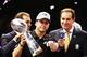 NEW ORLEANS, LA - FEBRUARY 03: Head coach John Harbaugh of the Baltimore Ravens holds the Vince Lombardi trophy as CBS announcer Jim Nantz looks on after the Ravens won 34-31 against the San Francisco 49ers during Super Bowl XLVII at the Mercedes-Benz Superdome on February 3, 2013 in New Orleans, Louisiana. (Photo by Christian Petersen/Getty Images)