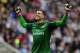 NEWCASTLE UPON TYNE, ENGLAND - MAY 19: Wojciech Szczesny of Arsenal celebrates after team-mate Laurent Koscielny scored the opening goal during the Barclays Premier League match between Newcastle United and Arsenal at St James' Park on May 19, 2013 in Newcastle upon Tyne, England. (Photo by Stu Forster/Getty Images)