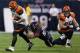 HOUSTON, TX - JANUARY 05: Andy Dalton #14 of the Cincinnati Bengals is tackled by Brooks Reed #58 of the Houston Texans during the AFC Wild Card Playoff Game at Reliant Stadium on January 5, 2013 in Houston, Texas. (Photo by Ronald Martinez/Getty Images)