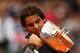 PARIS, FRANCE - JUNE 11: Rafael Nadal of Spain poses with the Coupe des Mousquetaires trophy in the men's singles final against Novak Djokovic of Serbia during day 16 of the French Open at Roland Garros on June 11, 2012 in Paris, France. (Photo by Clive Brunskill/Getty Images)