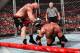 Brock Lesnar lays a brutal beating on Triple H with the steel chair. (Courtesy of WWE.com)
