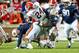 AUBURN, AL - NOVEMBER 10: Linebacker Cassanova McKinzy #30 of the Auburn Tigers attempts to tackle tailback Ken Malcome #24 of the Georgia Bulldogs on November 10, 2012 at Jordan-Hare Stadium in Auburn, Alabama. Georgia defeated Auburn 38-0 and clinched the SEC East division. (Photo by Michael Chang/Getty Images)