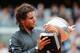 PARIS, FRANCE - JUNE 11: Rafael Nadal of Spain poses with the Coupe des Mousquetaires trophy in the men's singles final against Novak Djokovic of Serbia during day 16 of the French Open at Roland Garros on June 11, 2012 in Paris, France. (Photo by Mike Hewitt/Getty Images)