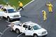 CONCORD, NC - MAY 26: Track workers clean up cable from an aerial Fox Sports camera on the front stretch during a red flag in the NASCAR Sprint Cup Series Coca-Cola 600 at Charlotte Motor Speedway on May 26, 2013 in Concord, North Carolina. The red flag was due to a rope that helps hold a aerial Fox Sports camera hanging above the 1.5-mile layout at Charlotte Motor Speedway snapped during the Coca-Cola 600. (Photo by Streeter Lecka/Getty Images)
