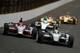 INDIANAPOLIS, IN - MAY 26: (Lead cars L-R) Marco Andretti, driver of the #25 RC Cola Chevrolet and Tony Kanaan of Brazil, driver of the Hydroxycut KV Racing Technology-SH Racing Chevrolet, leads a pack of cars during the IZOD IndyCar Series 97th running of the Indianapolis 500 mile race at the Indianapolis Motor Speedway on May 26, 2013 in Indianapolis, Indiana. (Photo by Chris Graythen/Getty Images)