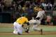 OAKLAND, CA - JUNE 22: Gregor Blanco #7 of the San Francisco Giants caught in a run-down gets tagged out at third base by pitcher Jarrod Parker #11 of the Oakland Athletics in the six inning at O.co Coliseum on June 22, 2012 in Oakland, California. (Photo by Thearon W. Henderson/Getty Images)