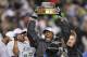 PHILADELPHIA - JANUARY 23: Injured wide receiver Terrell Owens #81 of the Philadelphia Eagles celebrates with the George Halas NFC Championship trophy after defeating the Atlanta Falcons 27-10 in the NFC Championship game at Lincoln Financial Field on January 23, 2005 in Philadelphia, Pennsylvannia. (Photo by Ezra Shaw/Getty Images)