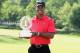 DUBLIN, OH - JUNE 03: Tiger Woods poses with the trophy after his two-stroke victory at the Memorial Tournament presented by Nationwide Insurance at Muirfield Village Golf Club on June 3, 2012 in Dublin, Ohio. (Photo by Scott Halleran/Getty Images)
