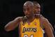 LOS ANGELES, CA - APRIL 12: Kobe Bryant #24 of the Los Angeles Lakers is consoled by Metta World Peace #15 of the Los Angeles Lakers after injuring himself against the Golden State Warriors in the second half at Staples Center on April 12, 2013 in Los Angeles, California. The Lakers defeated the Warriors 118-116. NOTE TO USER: User expressly acknowledges and agrees that, by downloading and or using this photograph, User is consenting to the terms and conditions of the Getty Images License Agreement. (Photo by Jeff Gross/Getty Images)
