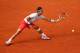PARIS, FRANCE - JUNE 01: Rafael Nadal of Spain stretches for a forehand in his Men's Singles match against Fabio Fognini of Italy during day seven of the French Open at Roland Garros on June 1, 2013 in Paris, France. (Photo by Clive Brunskill/Getty Images)