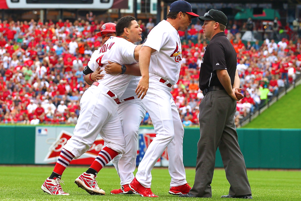 Yadier Molina somehow avoids ejection after putting hands on ump