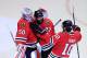 CHICAGO, IL - JUNE 01: (L-R) Goaltender Corey Crawford #50, Johnny Oduya #27 and Patrick Sharp #10 of the Chicago Blackhawks celebrate after defeating the Los Angeles Kings 2-1 in Game One of the Western Conference Final during the 2013 NHL Stanley Cup Playoffs at United Center on June 1, 2013 in Chicago, Illinois. The Blackhawks defeated the Kings 2-1. (Photo by Jamie Squire/Getty Images)