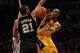 LOS ANGELES, CA - FEBRUARY 03: Kobe Bryant #24 of the Los Angeles Lakers passes around Tim Duncan #21 of the San Antonio Spurs during the first half at Staples Center on February 3, 2011 in Los Angeles, California. NOTE TO USER: User expressly acknowledges and agrees that, by downloading and or using this photograph, User is consenting to the terms and conditions of the Getty Images License Agreement. (Photo by Harry How/Getty Images)