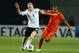PETAH TIQWA, ISRAEL - JUNE 06: Sebastian Rode (L) of Germany is challenged by Adam Maher of Netherlands during the UEFA European Under 21 Championship match between Netherlands and Germany at Ha Moshava Stadium on June 6, 2013 in Petah Tiqwa, Israel. (Photo by Alex Grimm/Getty Images)