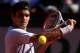 PARIS, FRANCE - JUNE 04: Roger Federer of Switzerland plays a backhand in his Men's Singles quarter final match against Jo-Wilfried Tsonga of France during day ten of the French Open at Roland Garros on June 4, 2013 in Paris, France. (Photo by Clive Brunskill/Getty Images)