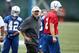 May 22, 2013; Indianapolis, IN, USA; Indianapolis Colts coach Chuck Pagano (middle) talks to quarterback Andrew Luck (12) during organized team activities at the Indiana Farm Bureau Football Center. Mandatory Credit: Brian Spurlock-USA TODAY Sports