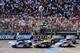 Aug 19, 2012; Brooklyn, MI, USA; NASCAR Sprint Cup Series drivers Brad Keselowski (2), Greg Biffle (16), Carl Edwards (99), Dale Earnhardt Jr. (88), Marcos Ambrose (9), Kasey Kahne (5), and Martin Truex Jr. (56) receive the green flag after a caution during the Pure Michigan 400 at Michigan International Speedway. Mandatory Credit: Tim Fuller-USA TODAY Sports