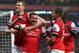 LONDON, ENGLAND - MAY 14: Lukas Podolski (2nd left) of Arsenal celebrates with team mates after scoring during the Barclays Premier League match between Arsenal and Wigan Athletic at Emirates Stadium on May 14, 2013 in London, England. (Photo by Shaun Botterill/Getty Images)