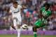 MADRID, SPAIN - APRIL 20: Casemiro (L) of Real Madrid CF competes for the ball with Nosa Iglebor (R) during the La Liga match between Real Madrid CF and Real Betis Balompie at Santiago Bernabeu Stadium on April 20, 2013 in Madrid, Spain. (Photo by Gonzalo Arroyo Moreno/Getty Images)
