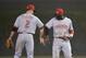 CHICAGO, IL- JUNE 10: Zack Cozart #2 of the Cincinnati Reds (L) and Brandon Phillips #4 celebrate their 6-2 win over the Chicago Cubs at Wrigley Field on June 10, 2013 in Chicago, Illinois. (Photo by Brian Kersey/Getty Images)